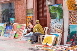 SANTO DOMINGO, DOMINICAN REPUBLIC – AUGUST 8, 2017: Artists on a city street. Copy space for text.