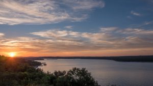 Lake,Travis,During,Sunset,With,Clouds,In,The,Sky