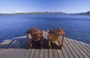 Two,Adirondack,Chairs,On,A,Deck,Overlooking,Lake,George,,Ny