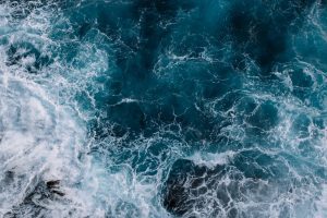 Aerial,View,To,Ocean,Waves.,Blue,Water,Background