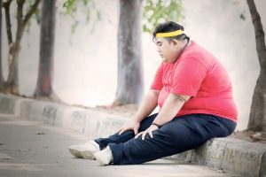 Obese,Man,Looks,Tired,After,Exercising,In,The,Park,While