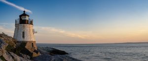 Beautiful,Lighthouse,Overlooking,The,Ocean,At,Sunset,,Near,Newport,Rhode
