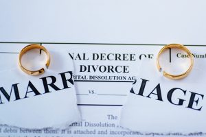 Divorce,Decree,And,Two,Broken,Wedding,Rings.,Divorce,And,Separation