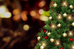 Festively,Decorated,Outdoor,Christmas,Tree,On,Blurred,Sparkling,Fairy,Background.