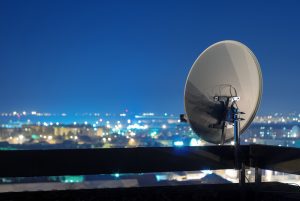 Satellite,Dish,Antenna,On,Top,Of,The,Building,In,Urban