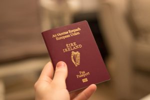 Irish,Passport,Held,In,Hand